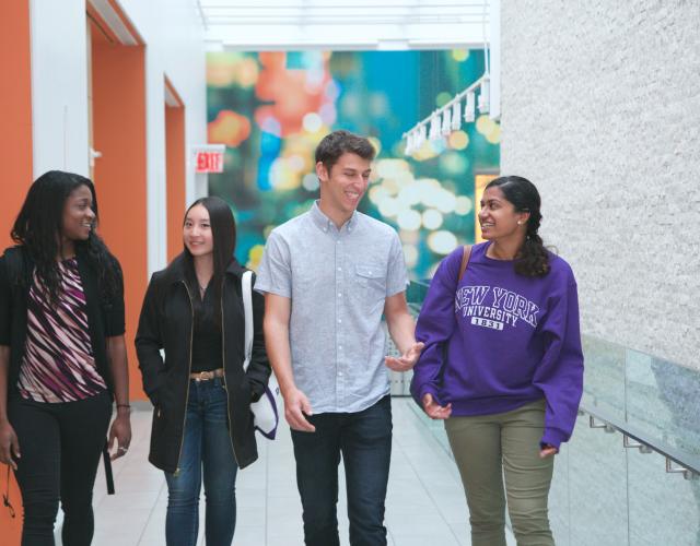 Students at Stern - Giving to Stern Students walking down the hall of Tisch