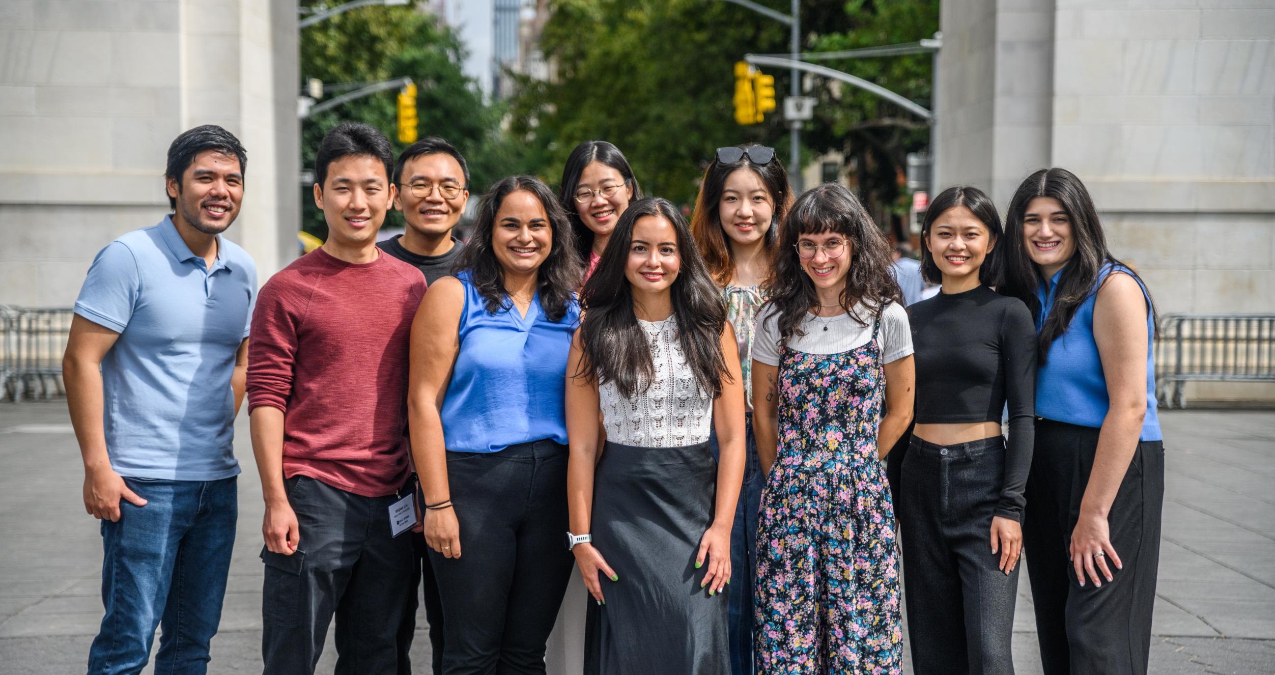 PhD students in front of Washington Sq Arch