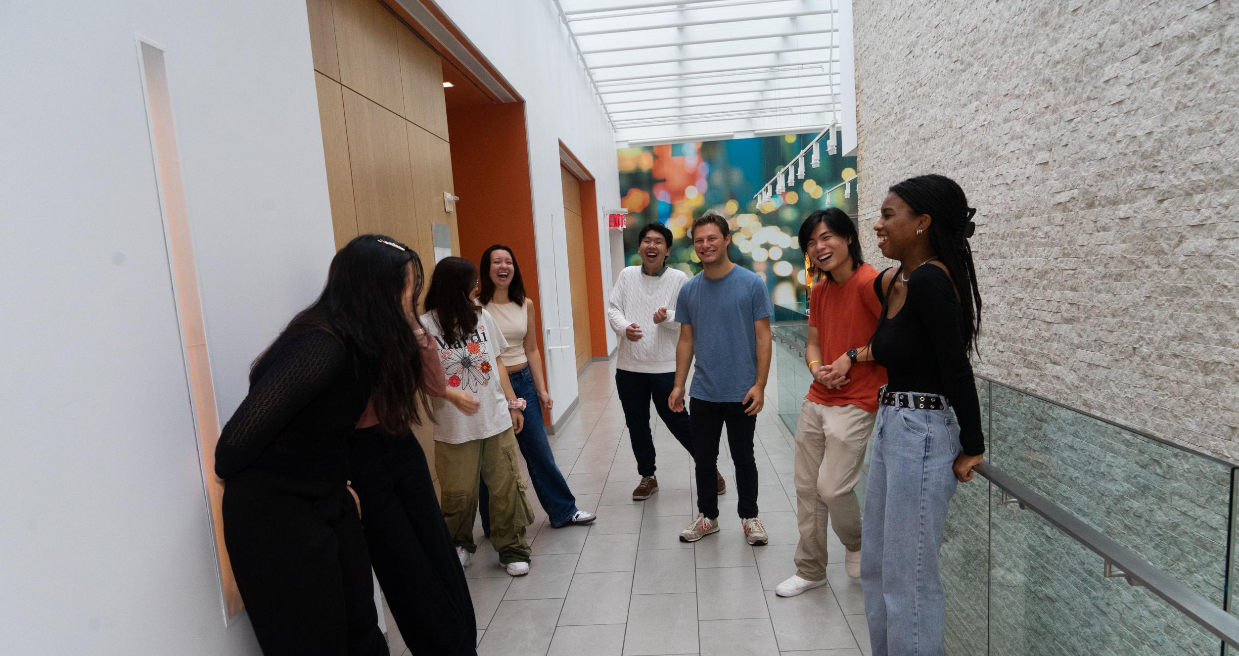 Students in UC hallway laughing