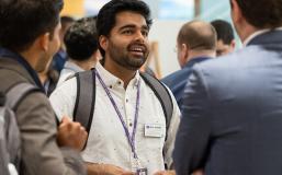 MiM - Powerful Global Network Student networking with classmates during a group interaction.