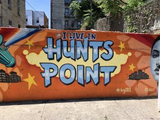 Image of a mural on the wall of a building that says I live in Hunts Point