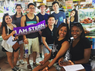 Students holding up banner 