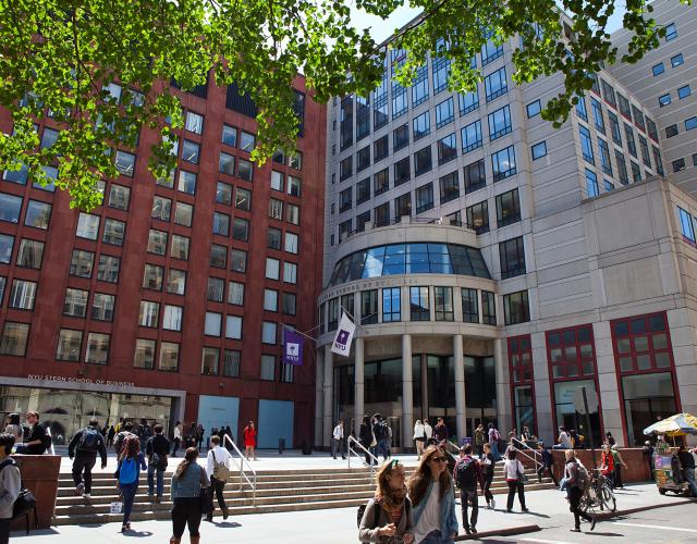 NYU Stern Exterior Exterior shot of Stern buildings with people walking on sidewalk