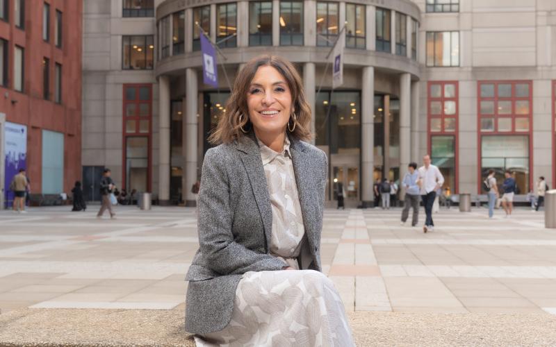 Suzy Welch sitting in front of NYU Stern
