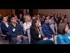 Attendees watching lecture at previous event