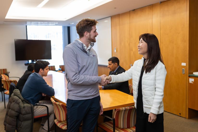 Nate Hudson (MBA ’24), a fellow with the Chen Institute for Global Real Estate Finance, meets Helen Hwang (NYU ’04) from Meridian Captial Groups at a luncheon