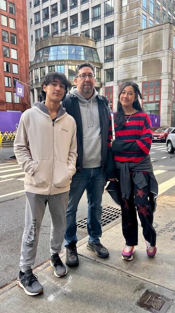 Francisco with his grown children in front of Stern